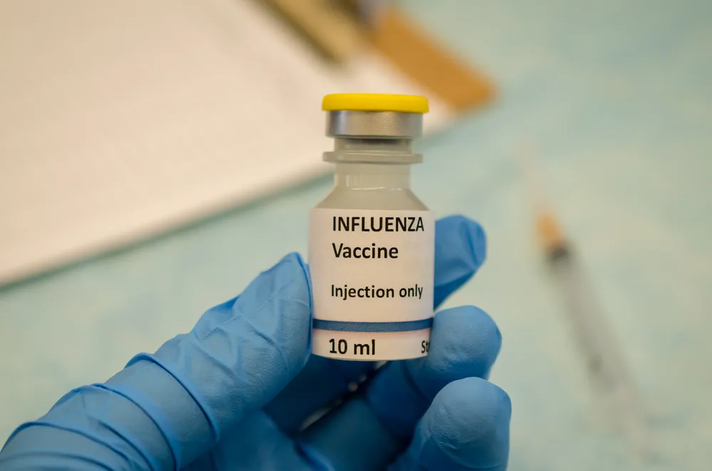 holding-influenza-vaccine-in-hand-2023-11-27-05-23-16-utc